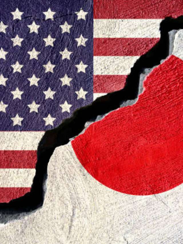 Concept american and Japan flag on cracked background