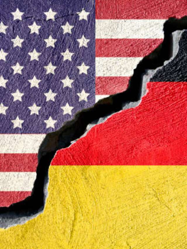 Concept american and Germany flag on cracked background