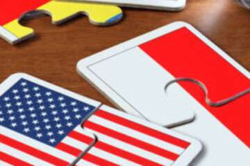 puzzle with the national flag of America and Indonesia on wooden table